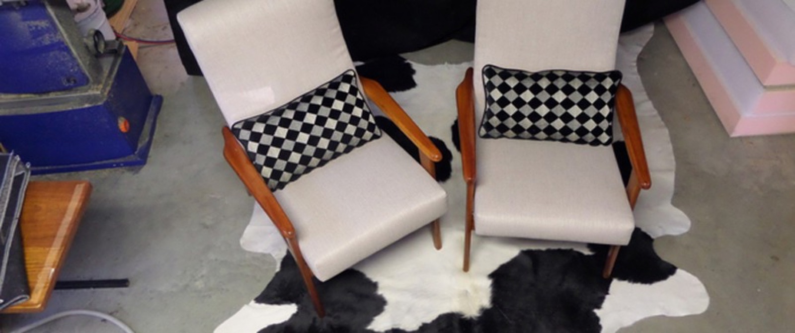 A pair of mid-century chairs recovered in the workshop