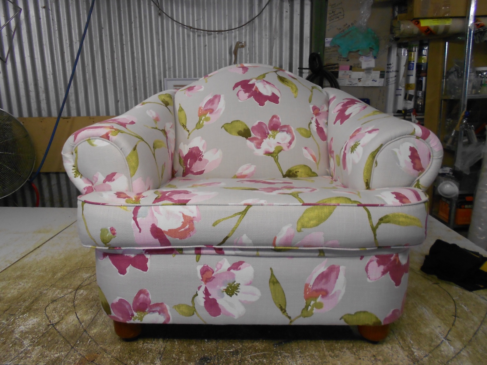 Armchair reupholstered in pink floral linen