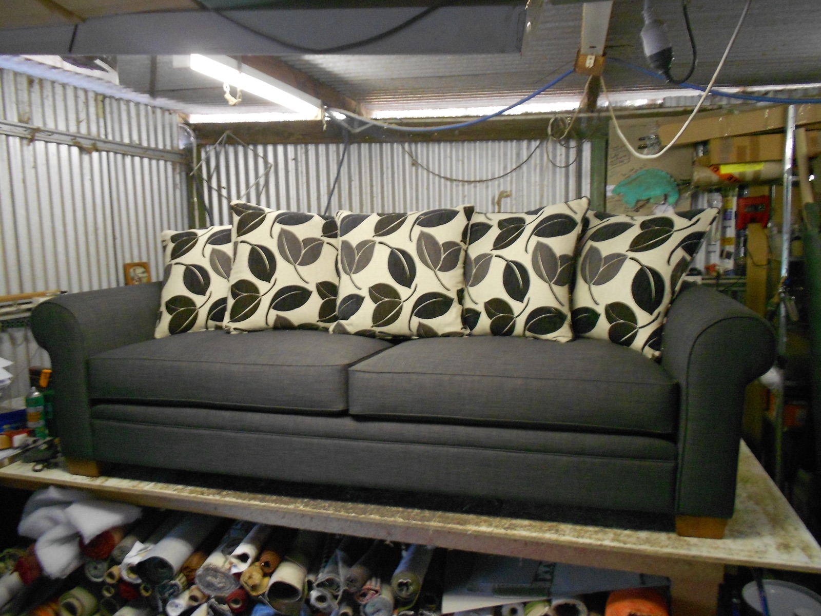 Reupholstered grey three-seat sofa