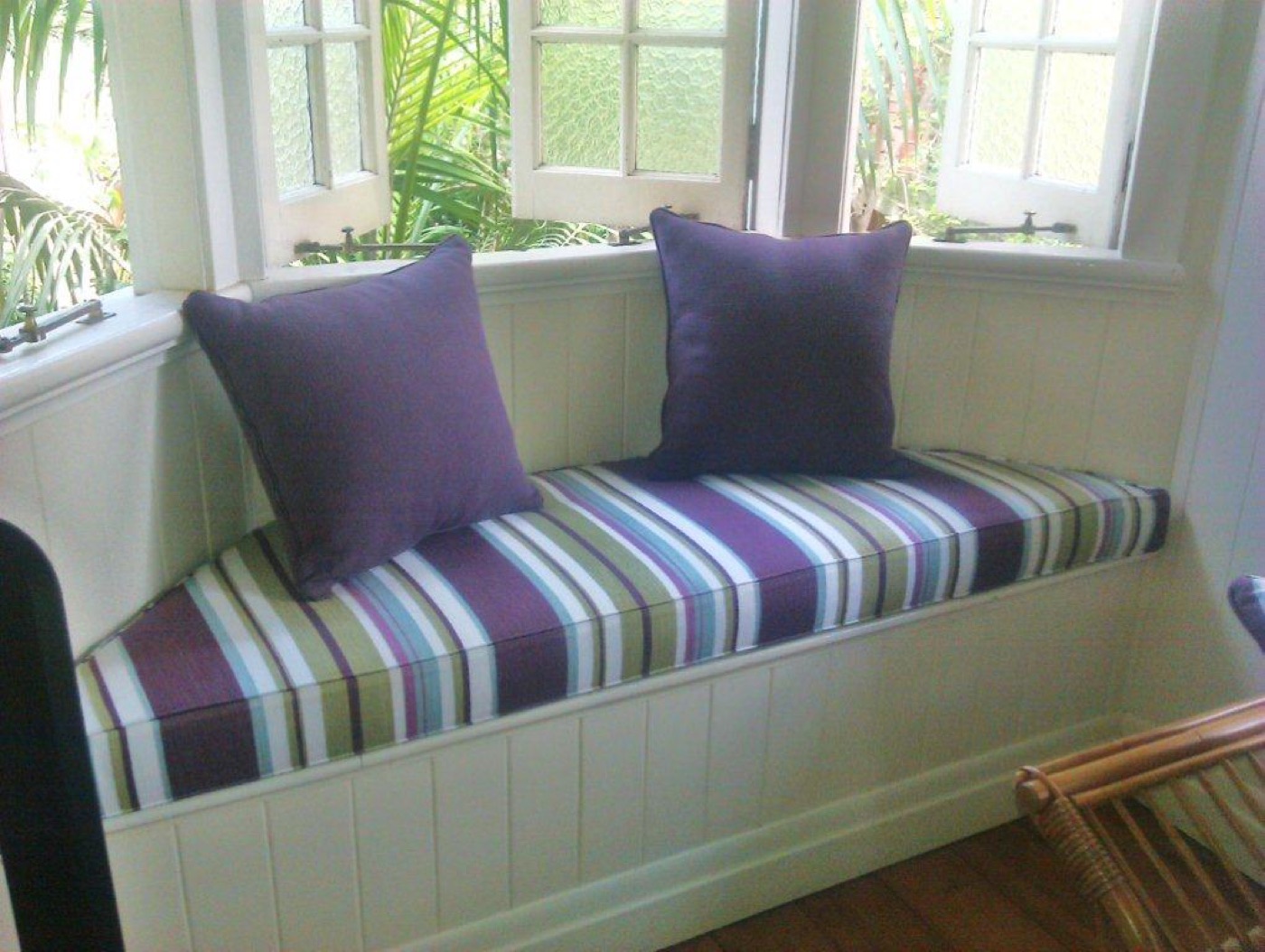 Custom striped window seat cushion with scatter cushions